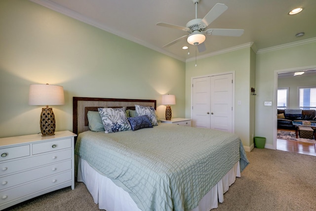 bedroom featuring baseboards, ornamental molding, light carpet, recessed lighting, and a closet