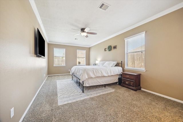 bedroom with visible vents, baseboards, carpet, and ornamental molding