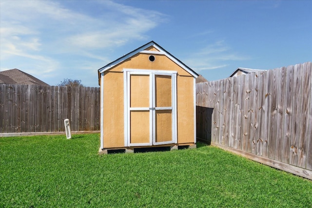 view of shed with a fenced backyard