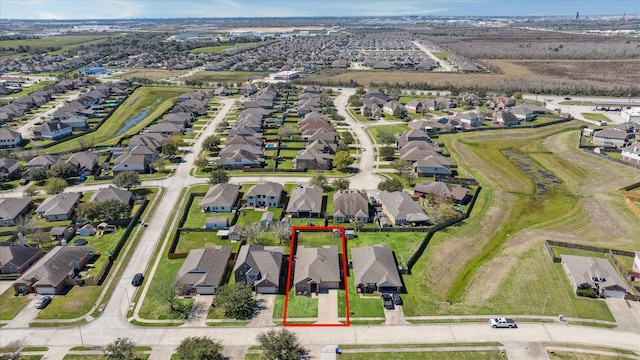 birds eye view of property with a residential view