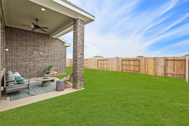 view of yard featuring a patio, a fenced backyard, a ceiling fan, and outdoor lounge area