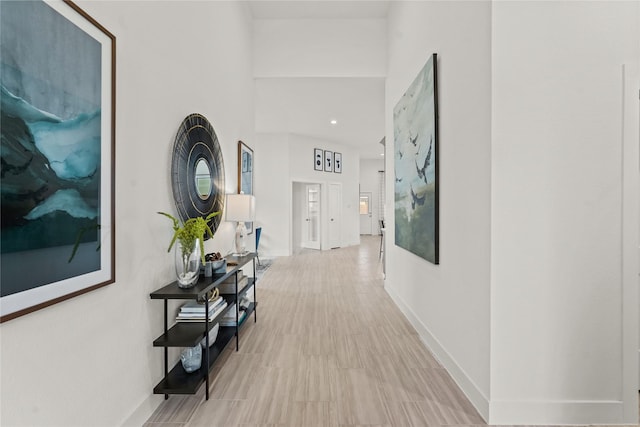 hallway featuring baseboards