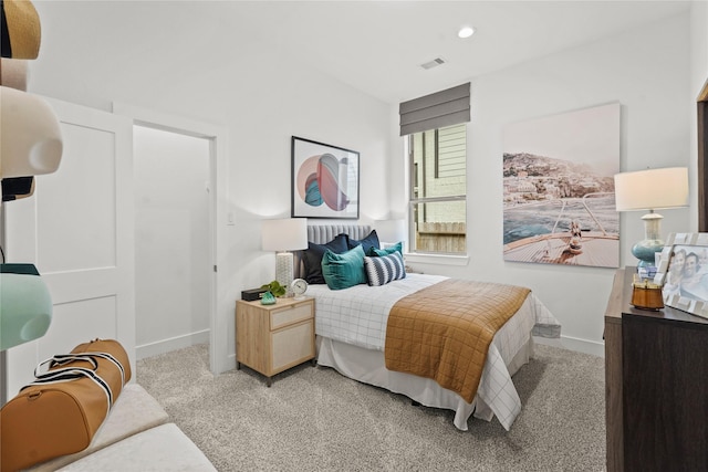 carpeted bedroom with recessed lighting, visible vents, and baseboards