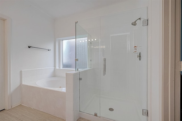 full bath featuring a stall shower and a bath