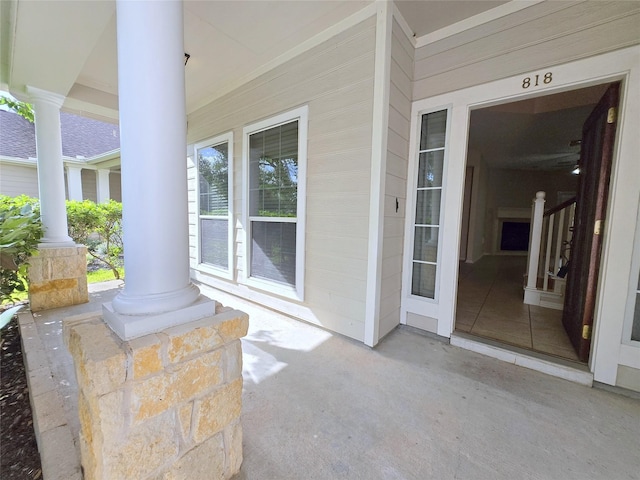 view of exterior entry with a porch