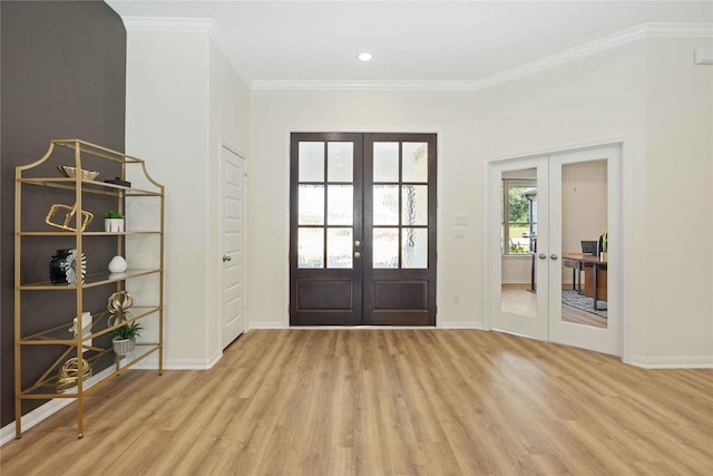 entryway featuring french doors, baseboards, wood finished floors, and crown molding