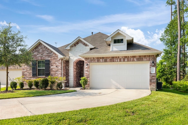 view of front facade with brick siding, a front lawn, central air condition unit, a garage, and driveway