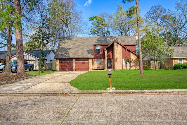 view of front of house featuring brick siding, fence, a front yard, a garage, and driveway