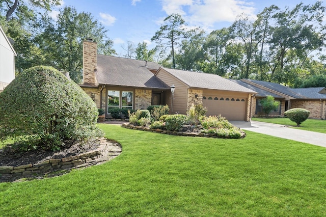 view of front of house with concrete driveway, an attached garage, brick siding, and a front yard