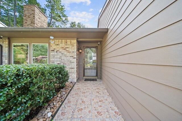 3130 Glade Springs Dr, Houston, TX 77339 - entrance to property with brick siding and a chimney