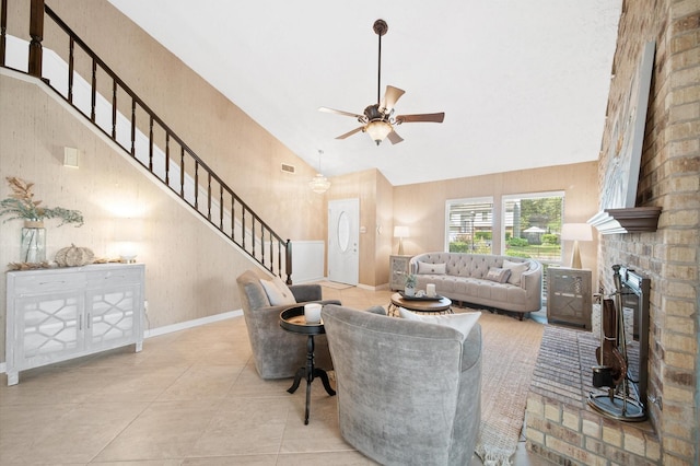 3130 Glade Springs Dr, Houston, TX 77339 - living area with high vaulted ceiling, a fireplace, ceiling fan, stairs, and tile patterned flooring