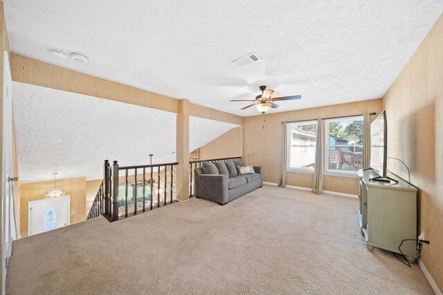 3130 Glade Springs Dr, Houston, TX 77339 - unfurnished living room featuring visible vents, a ceiling fan, a textured ceiling, carpet floors, and baseboards