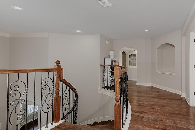 stairs with visible vents, recessed lighting, baseboards, and wood finished floors