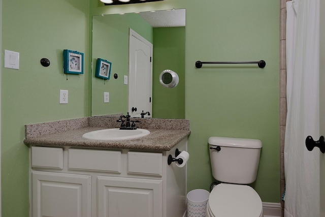 full bathroom featuring vanity and toilet