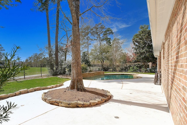 exterior space with a fenced in pool, a patio, and a fenced backyard