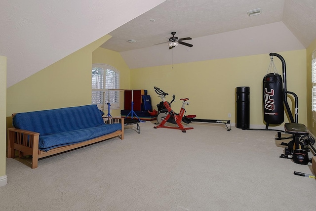 game room featuring carpet, visible vents, ceiling fan, vaulted ceiling, and a textured ceiling