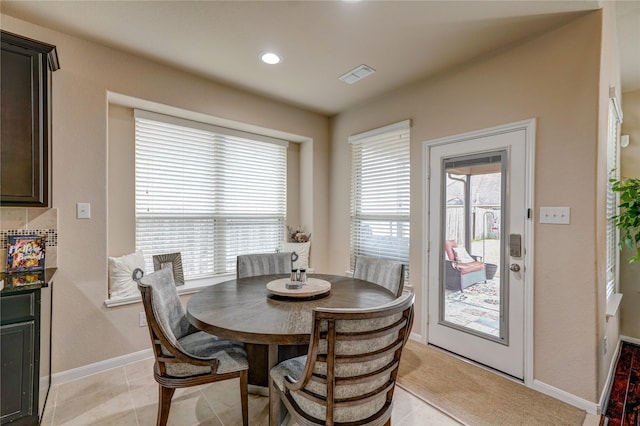 dining area featuring light tile patterned flooring, visible vents, recessed lighting, and baseboards