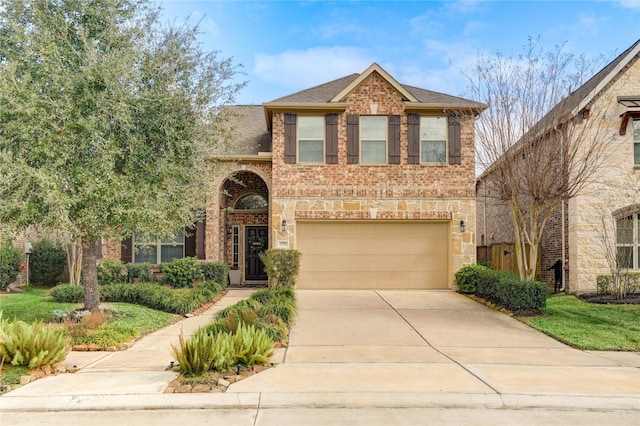 traditional-style house featuring brick siding, an attached garage, driveway, and a shingled roof