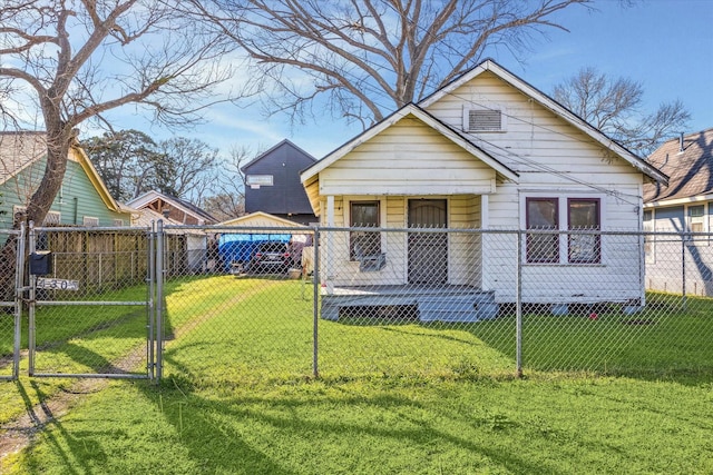 view of front facade with a porch, fence, a front lawn, and a gate