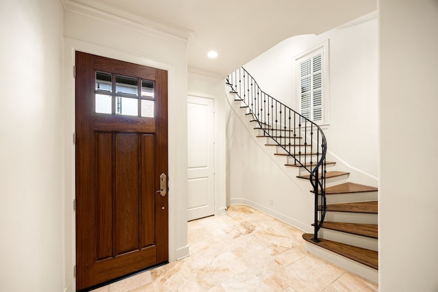 foyer with stairs, recessed lighting, baseboards, and ornamental molding