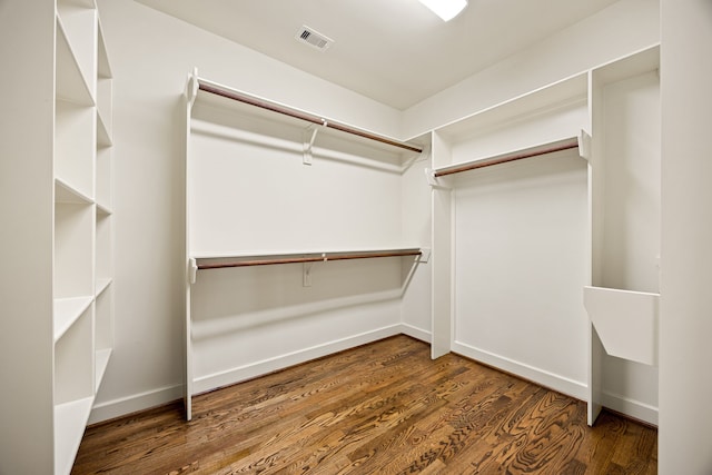 spacious closet with visible vents and wood finished floors