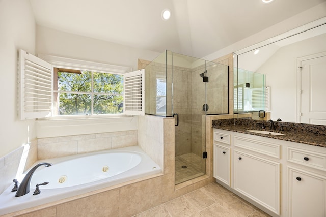 full bathroom with a whirlpool tub, recessed lighting, a shower stall, vanity, and vaulted ceiling