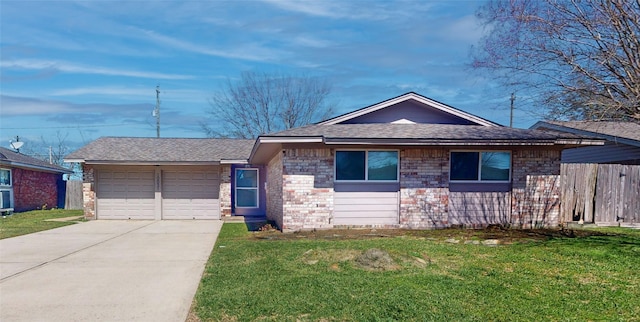 ranch-style house with a front lawn, a garage, brick siding, and concrete driveway