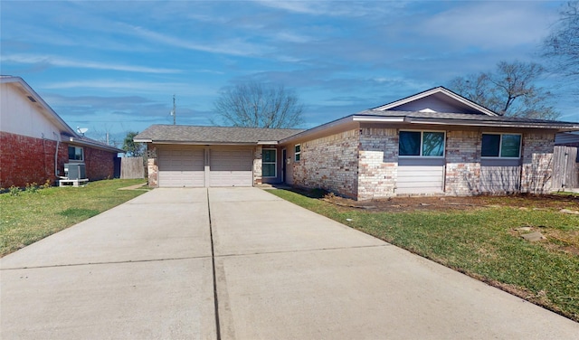 single story home with driveway, central AC, a front lawn, a garage, and brick siding