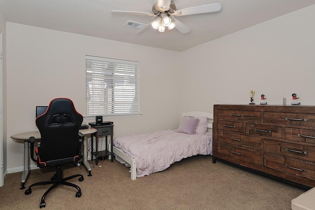 bedroom featuring light carpet, visible vents, baseboards, and a ceiling fan