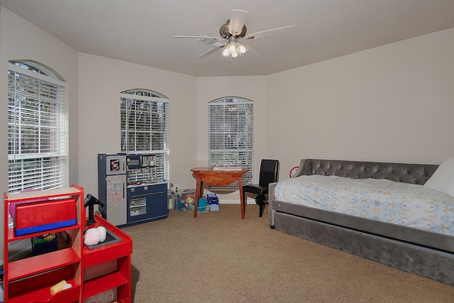 carpeted bedroom with a ceiling fan