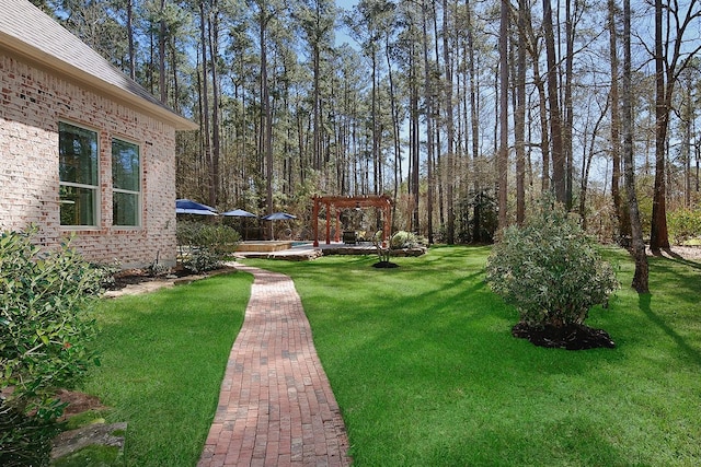 view of yard with a pergola