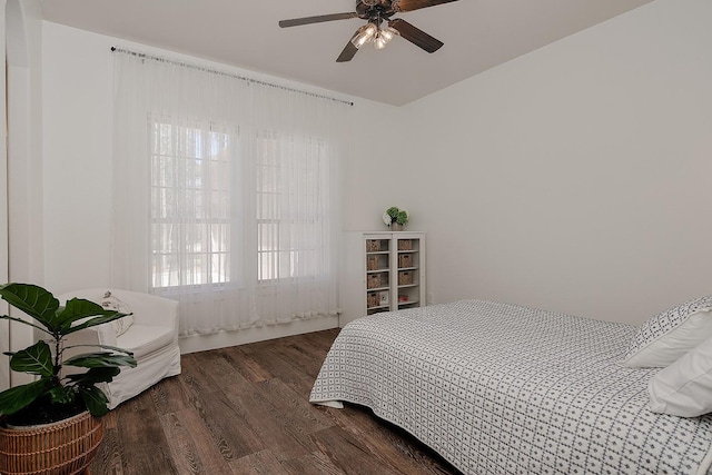 bedroom featuring a ceiling fan and wood finished floors