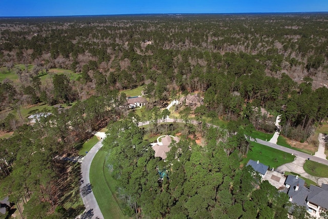 bird's eye view featuring a wooded view