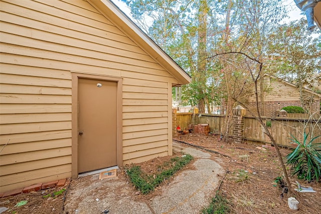 exterior space with an outbuilding and fence