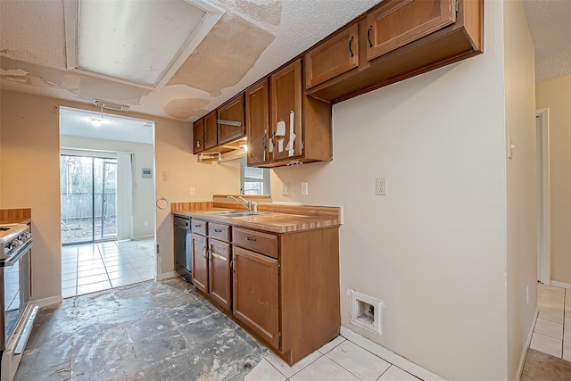 kitchen with visible vents, electric stove, a sink, black dishwasher, and light countertops