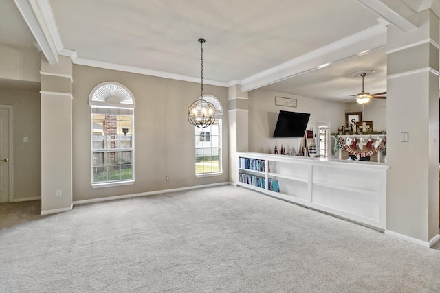 unfurnished living room featuring baseboards, carpet floors, crown molding, and ceiling fan with notable chandelier