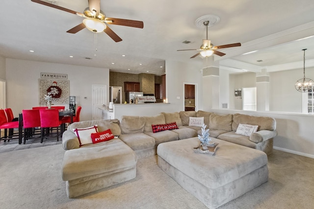 living area with recessed lighting, ceiling fan with notable chandelier, visible vents, and light carpet