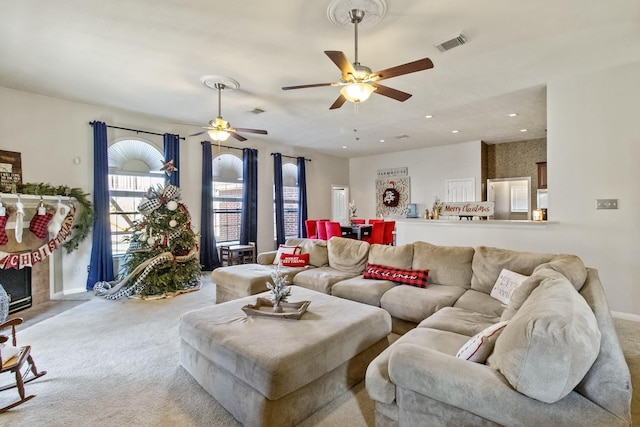 living area featuring visible vents, recessed lighting, carpet floors, baseboards, and ceiling fan