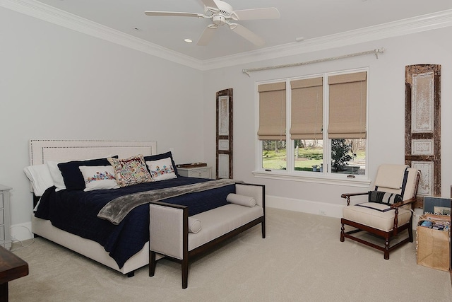 bedroom with light colored carpet, ceiling fan, baseboards, and ornamental molding