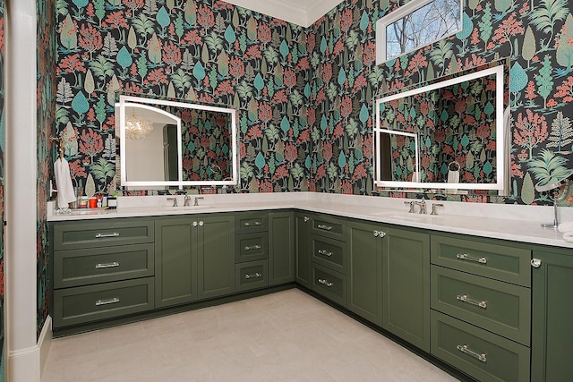 full bathroom with wallpapered walls, double vanity, crown molding, and a sink