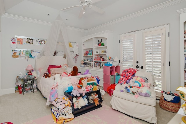 bedroom with baseboards, a ceiling fan, crown molding, and carpet