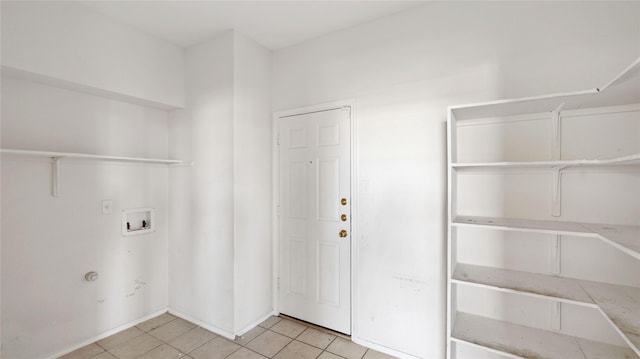 laundry room with light tile patterned floors, washer hookup, and laundry area