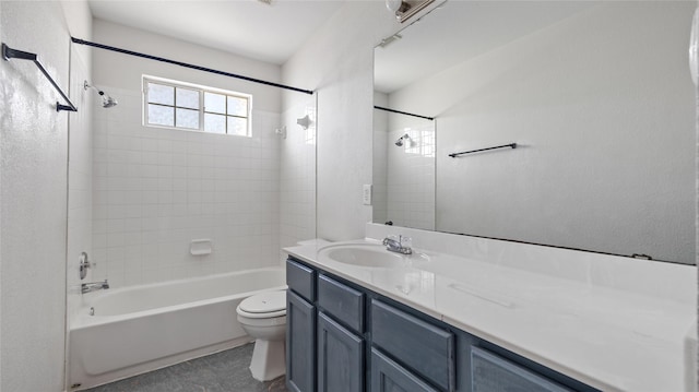 bathroom featuring toilet, vanity, and  shower combination