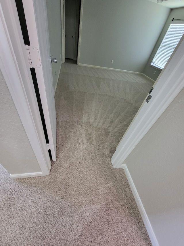 interior space featuring baseboards