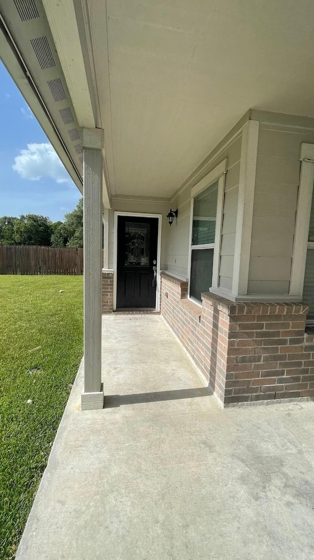 view of patio / terrace featuring fence