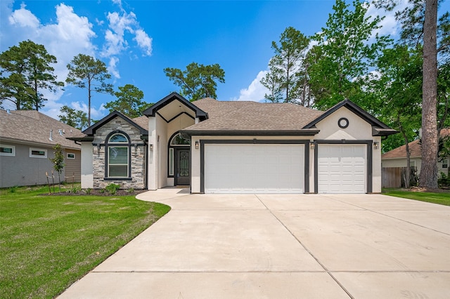 11706 Walden Rd, Montgomery, TX 77356 - ranch-style home with stone siding, a garage, stucco siding, a front yard, and driveway