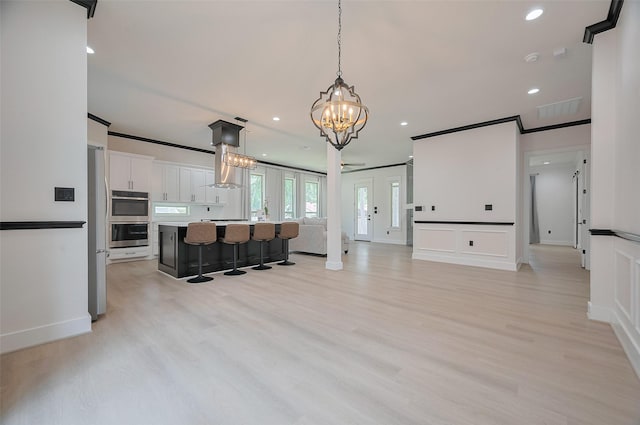 11706 Walden Rd, Montgomery, TX 77356 - interior space featuring crown molding, recessed lighting, an inviting chandelier, and light wood-style floors