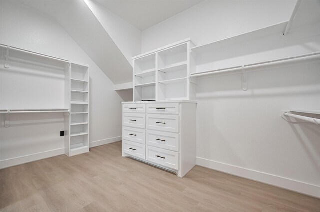 11706 Walden Rd, Montgomery, TX 77356 - spacious closet with vaulted ceiling and light wood finished floors