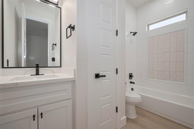 11706 Walden Rd, Montgomery, TX 77356 - full bath with vanity, shower / bathing tub combination, wood finished floors, and toilet