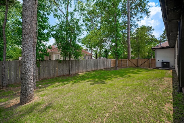 11706 Walden Rd, Montgomery, TX 77356 - view of yard with central AC, a gate, and a fenced backyard